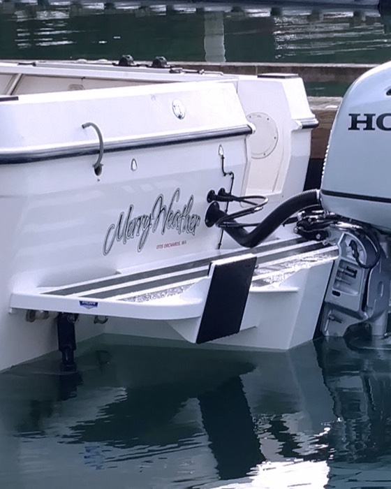 Close up view of a boat's outboard out in the water